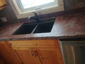 concrete countertop with sink, natural edge